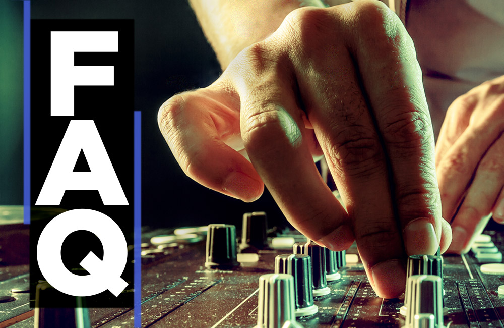 SEISMIC SOUND DJs: FAQ — close up of DJs fingers turning knobs on a sound board