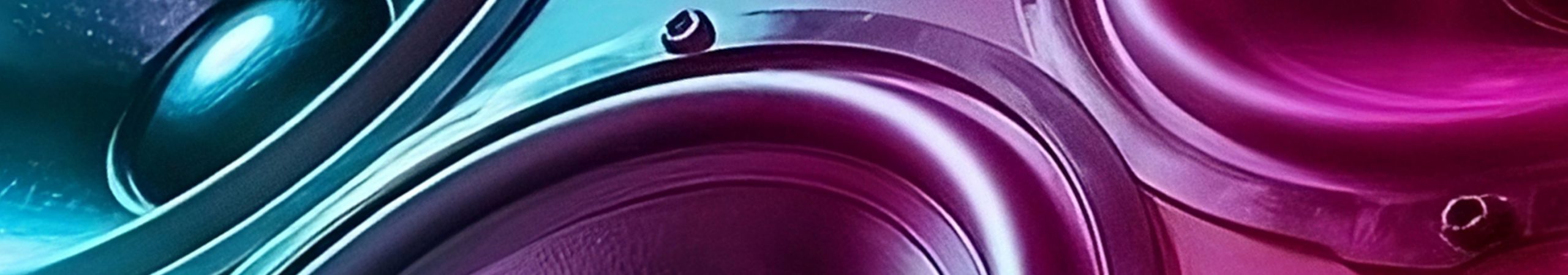 Close-up speaker woofers bathed in blue and purple lighting